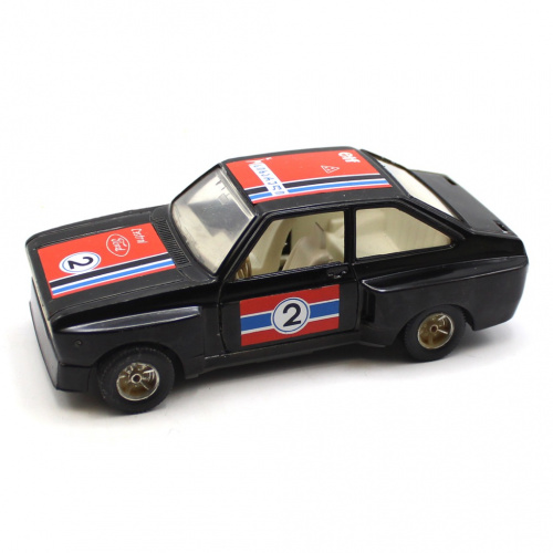 Модель гоночного автомобиля «Ford Escort RS 1800». Сверху металл, снизу пластмасса. Масштаб 1/24. Двери открываются. Размер 16 см